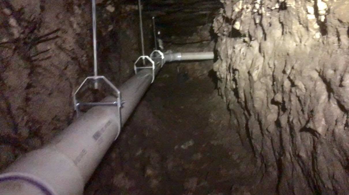 New PVC pipe hung in a finished tunnel before backfilling